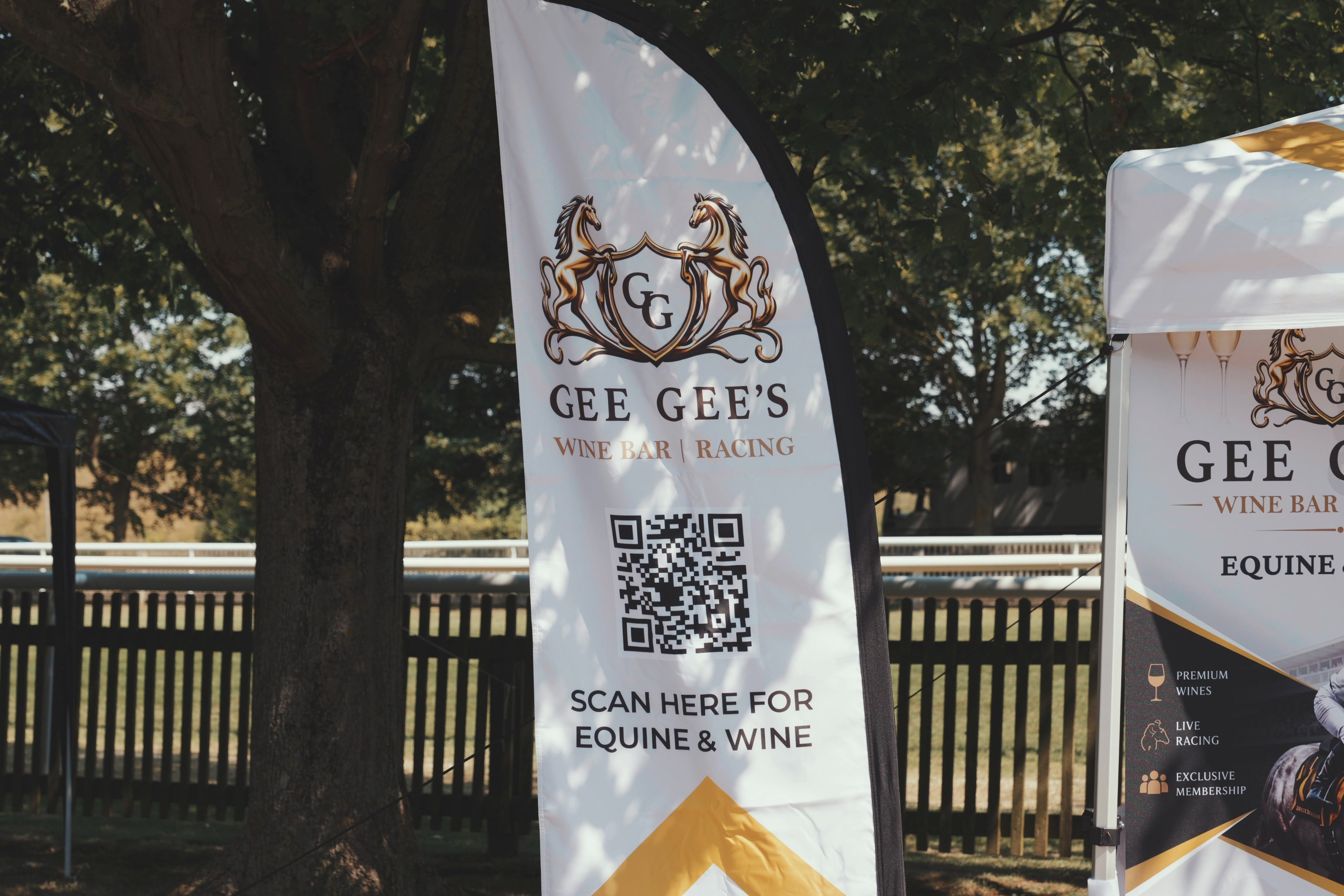 Gee Gee's Wine Bar & Racing branded banner at Newmarket racecourse